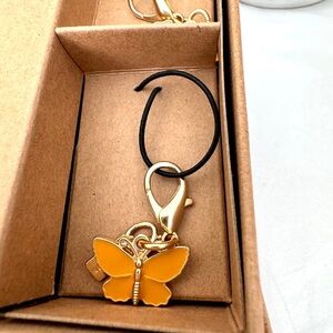 NWOT Coach Removable key chain bag charm Butterfly In Orange/gold